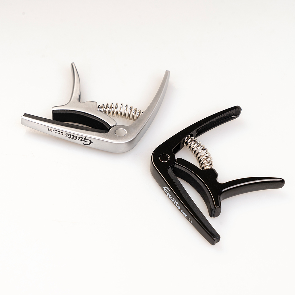 GUITTO Ukulele GGC-07 Capo Qui - Musical Instrument Types avis et prix